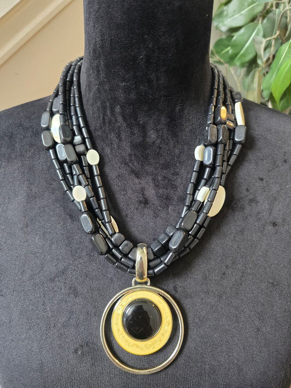 Black Multi Strand Gold Circle Pendant Necklace